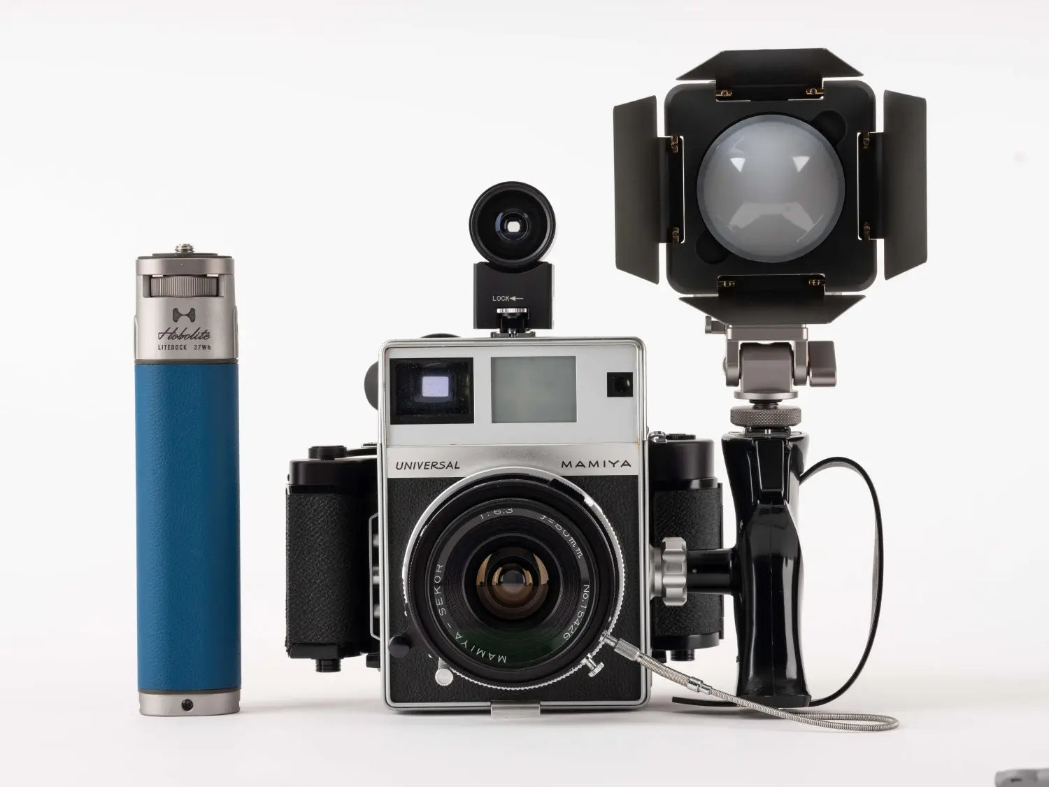 Hobolite LiteDock-X power bank with Mamiya Universal camera and LED light for portable photography.