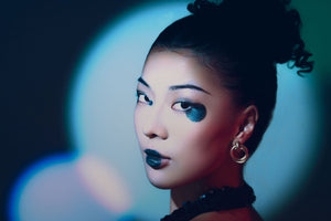 High-fashion portrait showcasing dramatic blue and red constant lighting effects achieved with professional Harlowe studio photography equipment setup