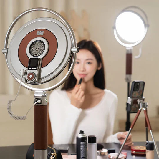 Harlowe Sol 40 circular LED light illuminating a beauty creator filming makeup on a smartphone tripod.