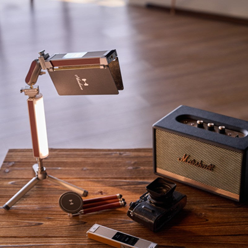 Harlowe Blade 5 light on tripod with vintage camera, Marshall speaker, and accessories.