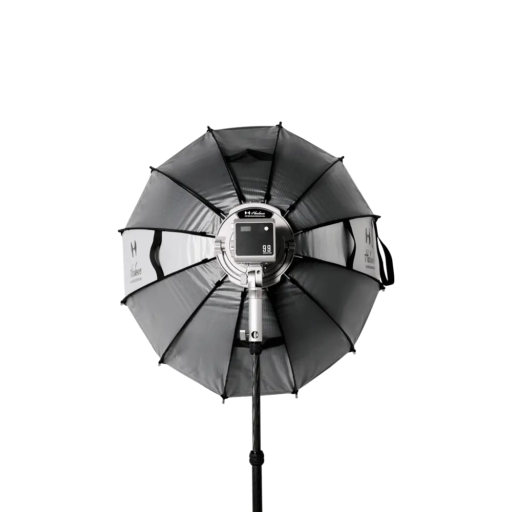 Harlowe 47-inch deep parabolic softbox with digital LED light, featuring adjustable black and silver panels for professional photography.
