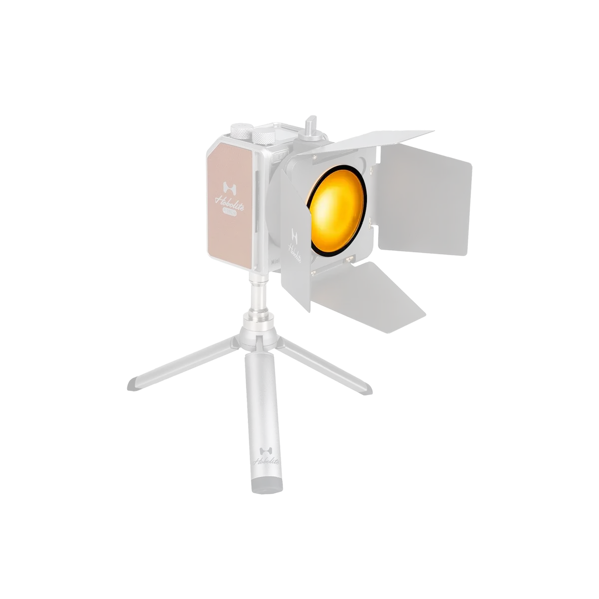 Hobolite Mini LED light with yellow gel filter and barn doors on tripod.