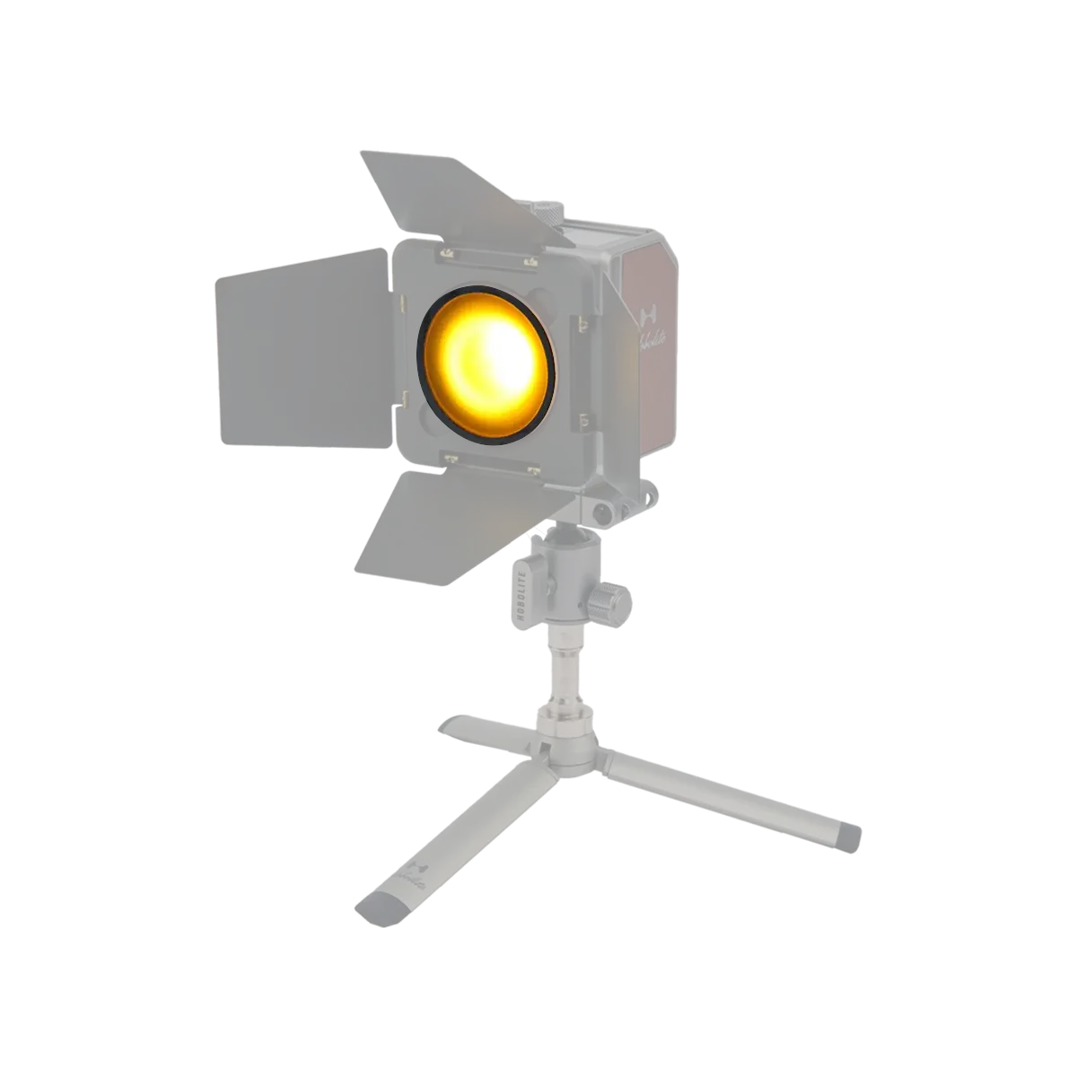 Hobolite Mini Barndoor attachment on tripod, featuring adjustable black flaps and a glowing yellow light for photography.