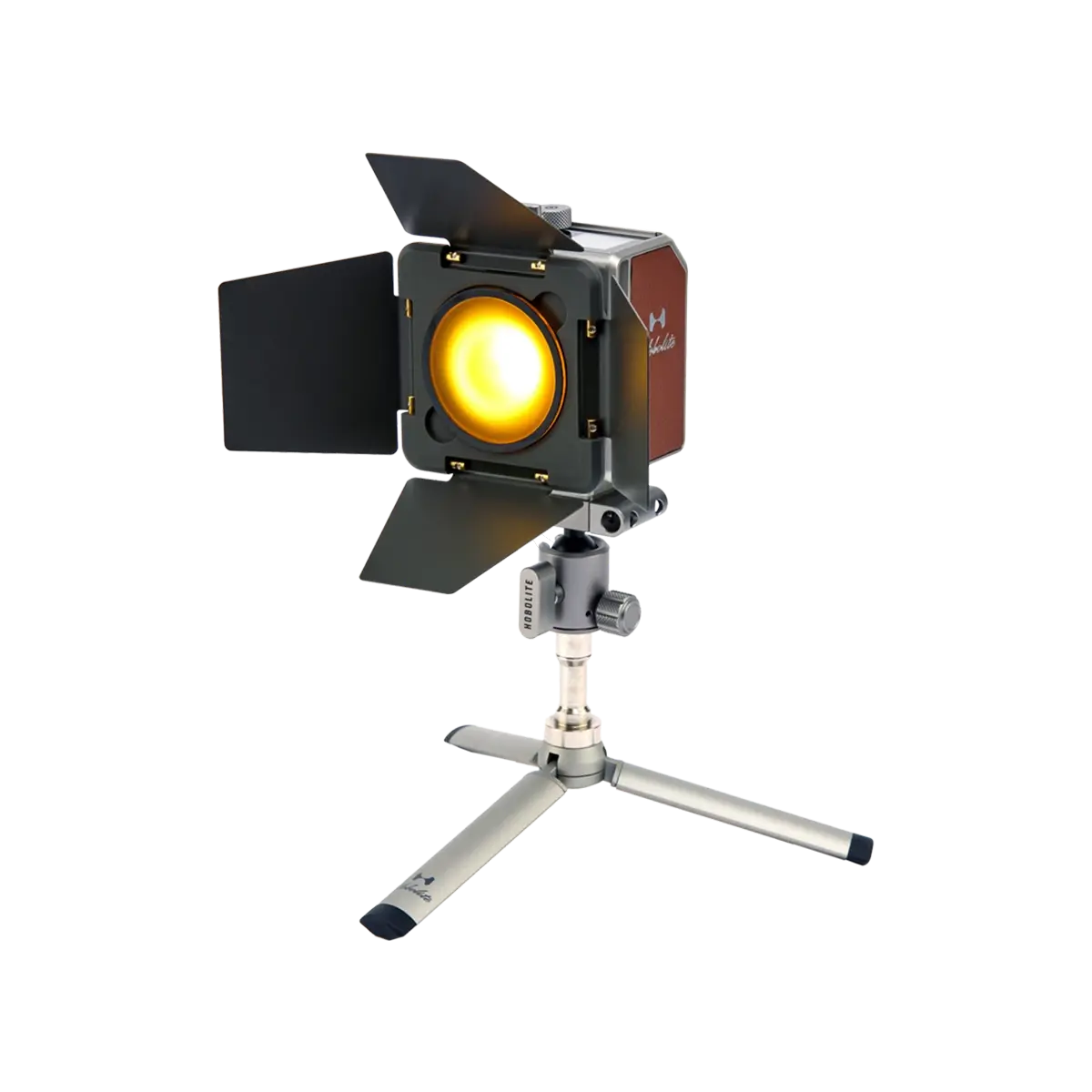 Hobolite Mini Barndoor Set on a tripod with yellow light and adjustable black flaps for versatile photography lighting.