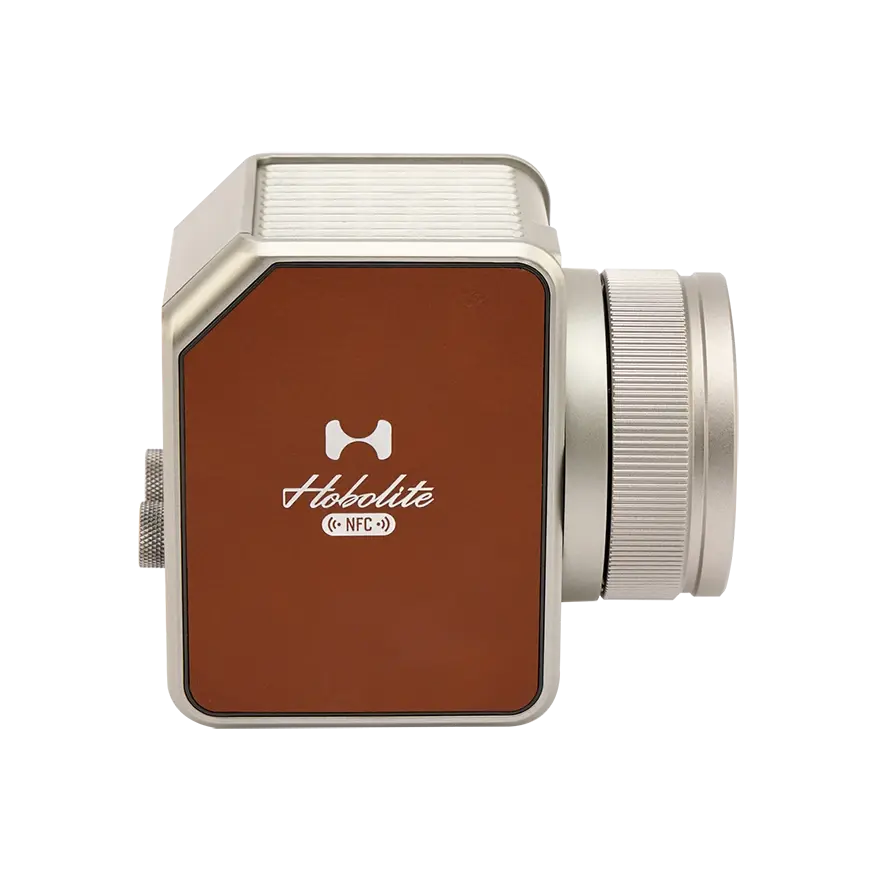 Silver Hobolite Avant lens accessory with textured grip and brown leather panel featuring the Hobolite logo and NFC.