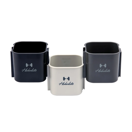 Hobolite Cup Holder Set: three navy blue, dark gray, off-white holders with logo, interlocking for light stands.