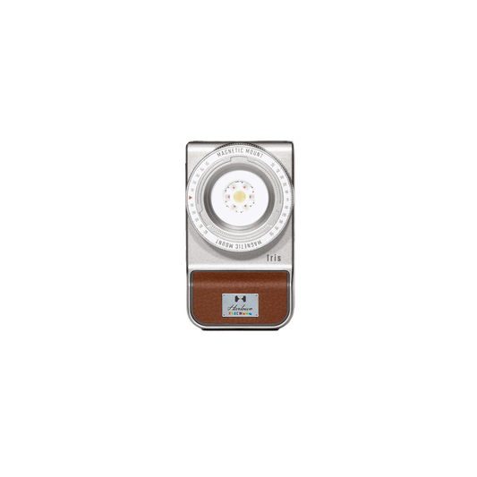Harlowe Iris 5W Spectra RGBCW LED light for content creation, silver with brown panel and colorful logo.