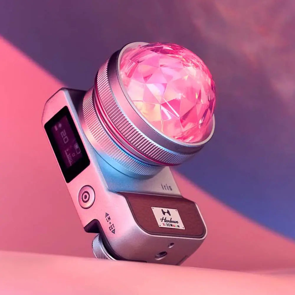 Harlowe Iris 5W Spectra LED light featuring a pink crystal dome and sleek silver body, perfect for photographers and content creators.