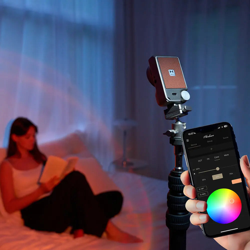 Harlowe Iris Spectra LED light with tripod, showing app control on phone for color mixing. Content creation lighting.