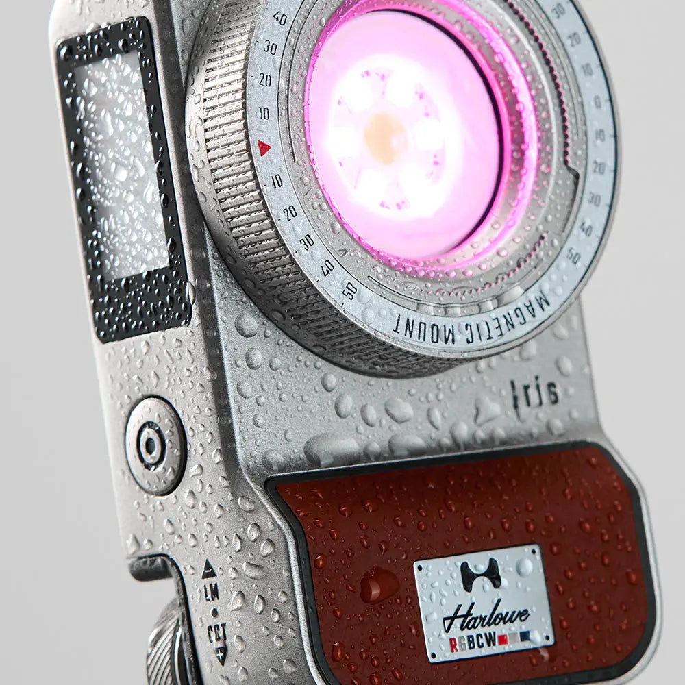 Harlowe Iris 5W Spectra RGBCW LED light, silver, water droplets, pink light, magnetic mount. Content creation detail.