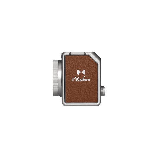 Hobolite Micro 8W LED light with silver body and brown leather panel showing Hobolite branding for product appearance.