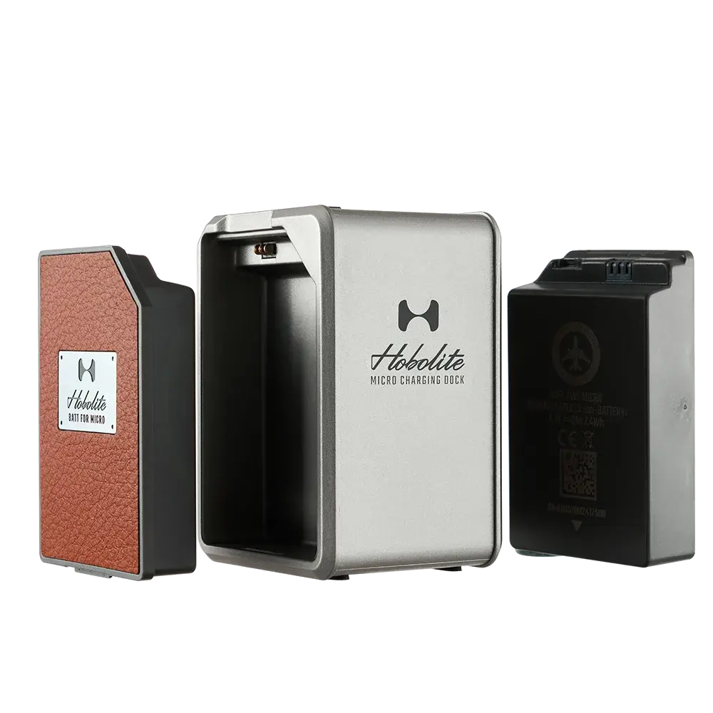 Harlowe Micro LED light kit components: charging dock, battery, and light module with brown leatherette finish.