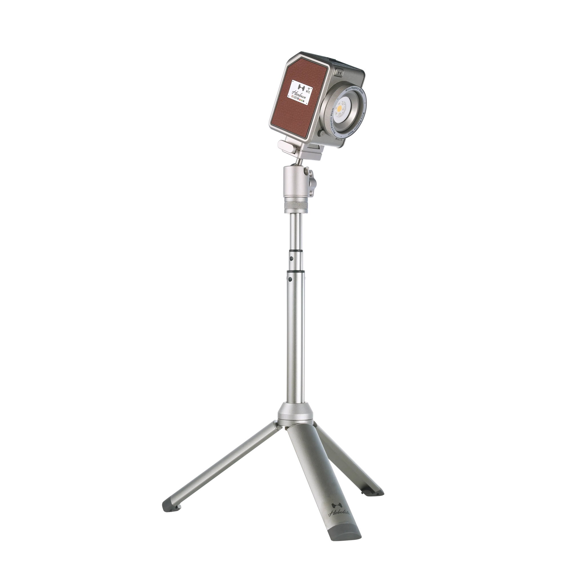 Compact Harlowe Micro 8W Spectra RGBCW LED light with adjustable silver tripod for versatile content creation.