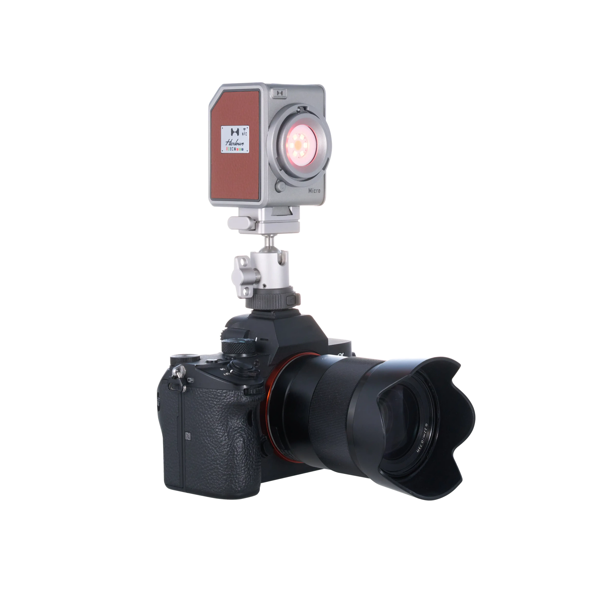 Compact Harlowe Micro 8W RGBCW LED light mounted on professional camera with adjustable mount.