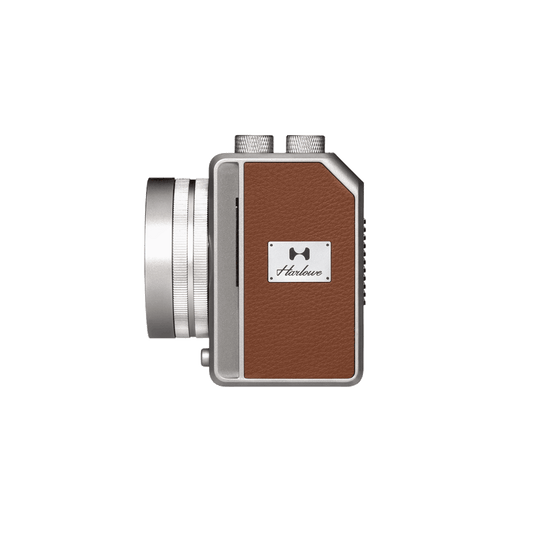 Harlowe Mini II 20W bi-color studio light, side view, silver lens, brown leather body, for photo & video.