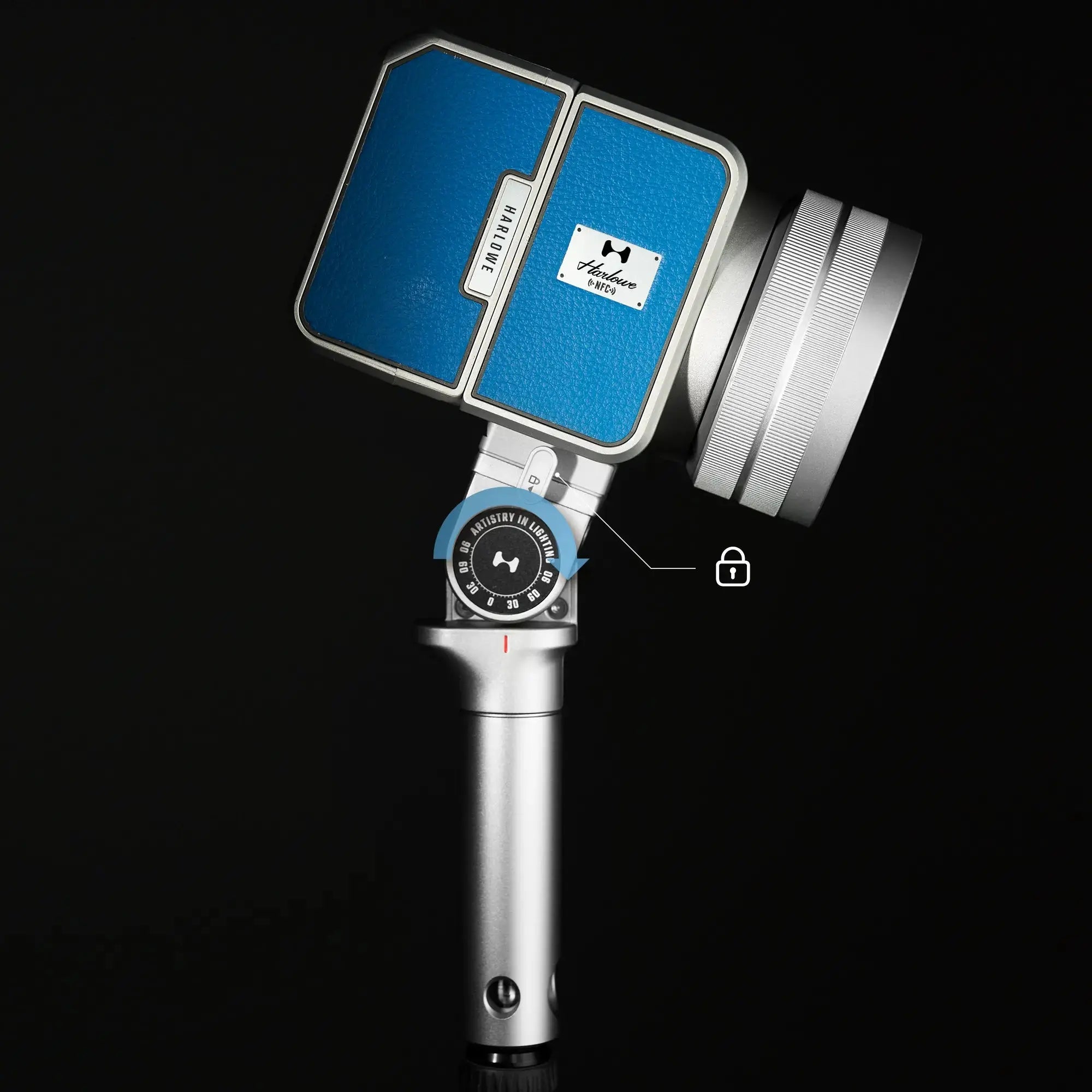 Harlowe Max-X 40W LED light with silver body, blue panel, and adjustable mount on dark background.