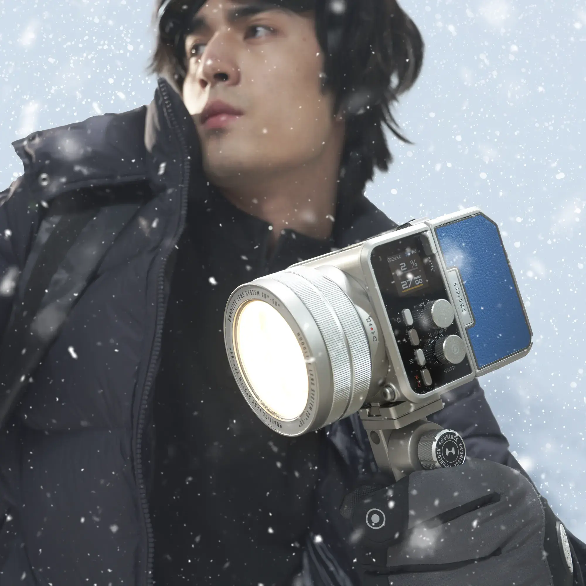 Harlowe Max-X 40W LED light kit in snow, demonstrating IP54 weather resistance for outdoor photography.