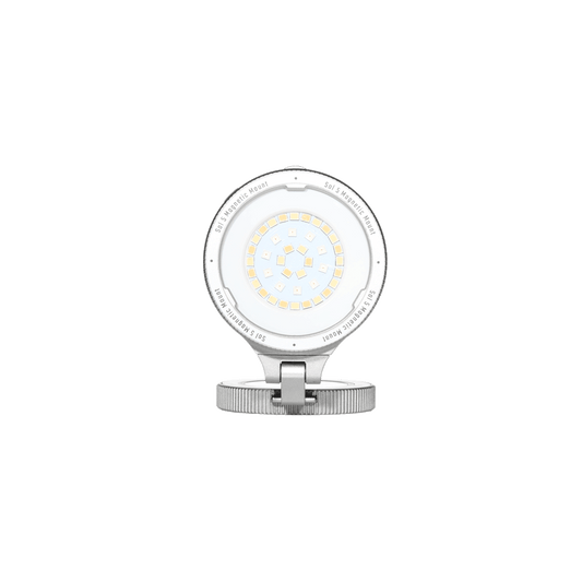 Harlowe Sol 5 Spectra RGBCW mobile light with MagSafe, compact white circular LED array on silver adjustable base.