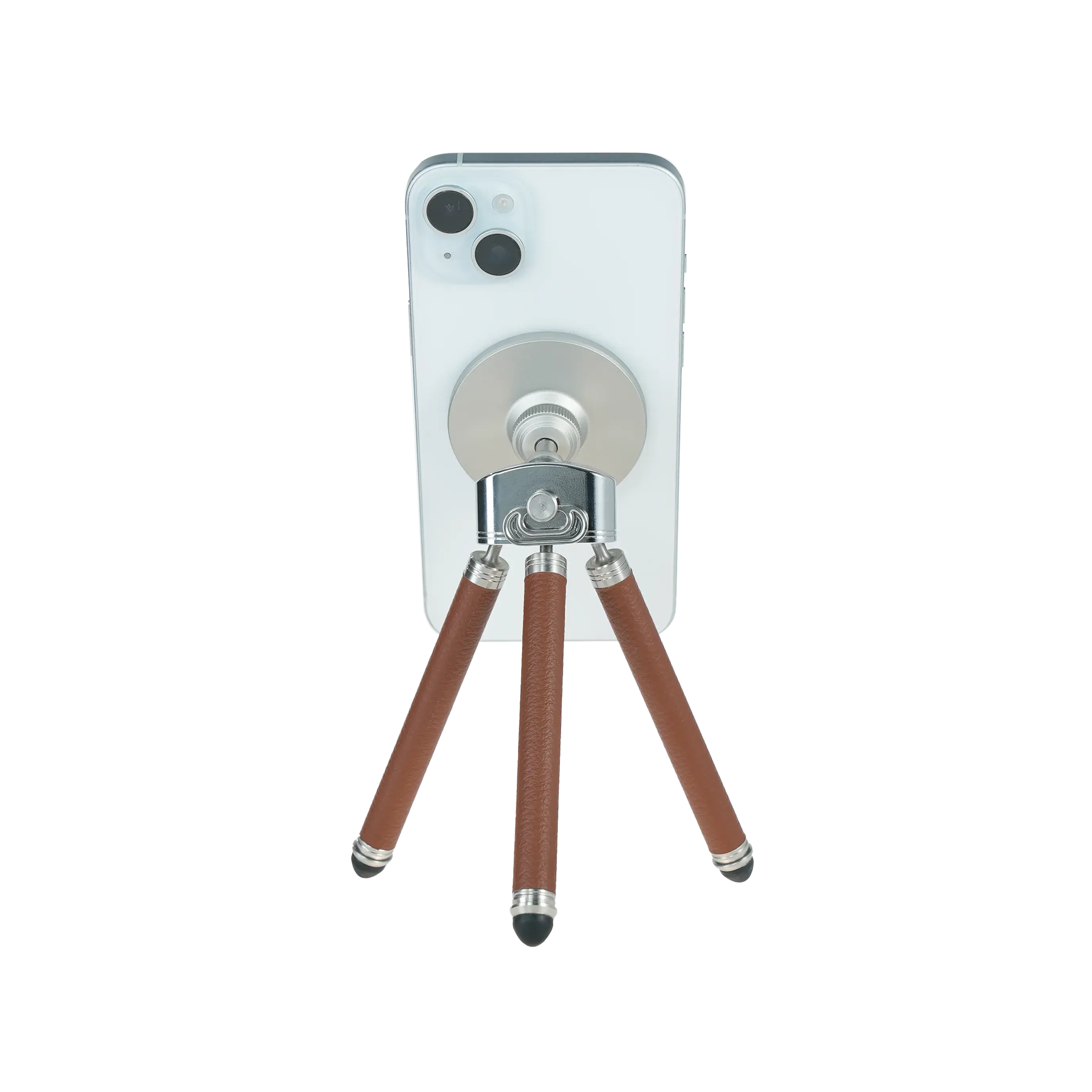 Harlowe Tabletop Tripod for MagSafe with white iPhone, brown leather legs and silver accents.