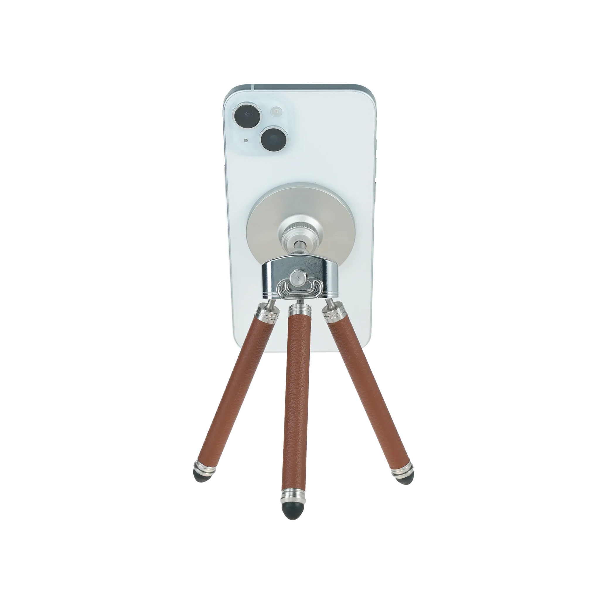 Harlowe Tabletop Tripod for MagSafe with white iPhone, brown leather legs and silver accents.