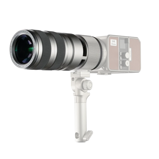 Harlowe Optical Light Lens with Gobo for MAX Series, silver telescoping lens with brown accent housing, on black background.