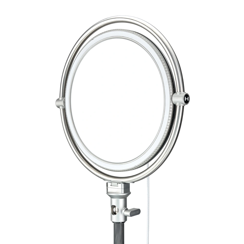 Harlowe Sol 40W round LED panel light with silver frame, adjustable mount, and H logo detail.