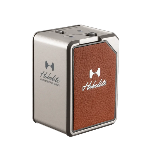 Hobolite Micro charging dock with two batteries, compact metallic grey design with brown leather accent and Hobolite logo.