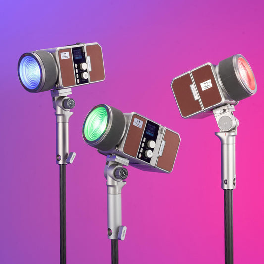 Three Harlowe Max Spectra lights on stands, each set to a different colour