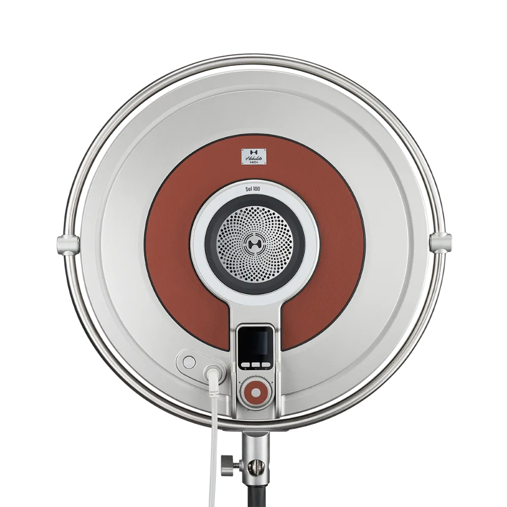 Harlowe Sol 100W professional LED panel light with white circular design, rust accent ring, and digital controls.
