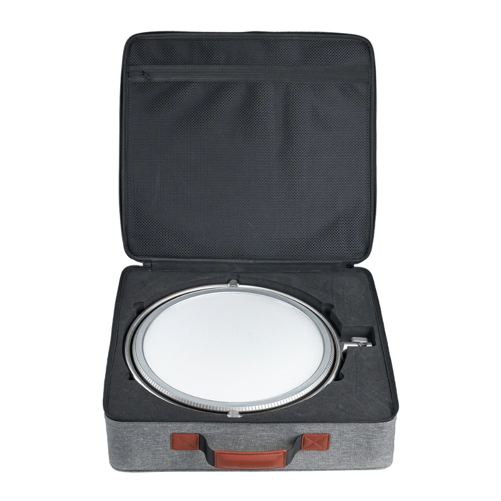 Harlowe Sol 100W round LED panel light in protective case with foam insert, gray fabric carrying case.