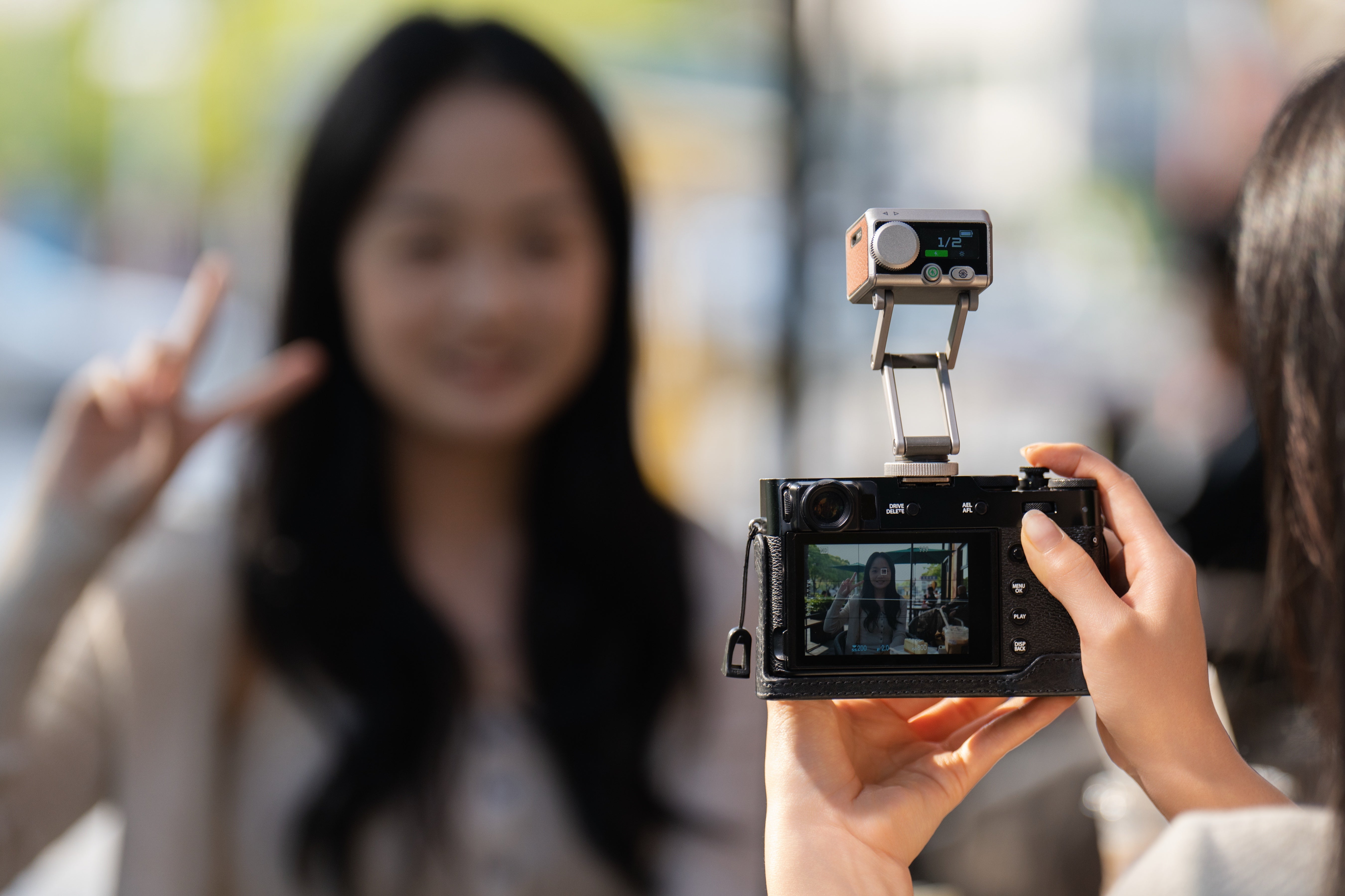 Creator using Pocket Flash to photograph a friend outdoors